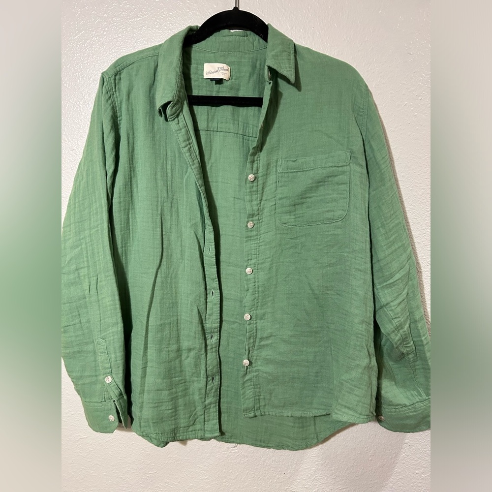 Sage green, size L. Universal threads button up top.